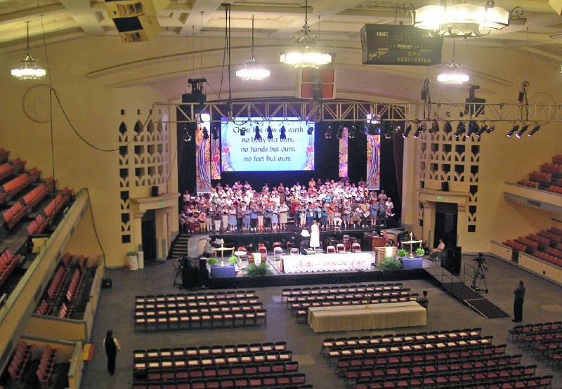 15 - Final Choir Rehearsal.jpg - Dr. Charlene Archibeque leads the choir in its final rehearsal at the San Jose Civic Center, one of two planned places for Sunday worship.